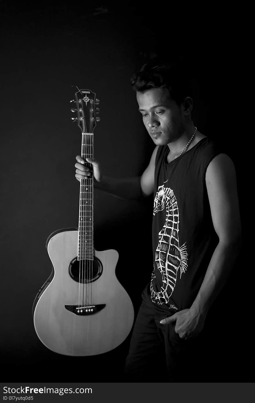 Man Holding Acoustic Guitar