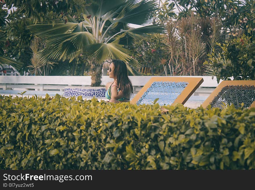 Woman Wearing Teal Bikini Top