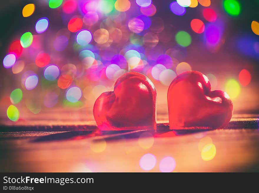 Red Little Decorative Hearts On Wooden Background With Amazing Bokeh Lights. Love Or Romantic Valentine Day Concept. Toned.