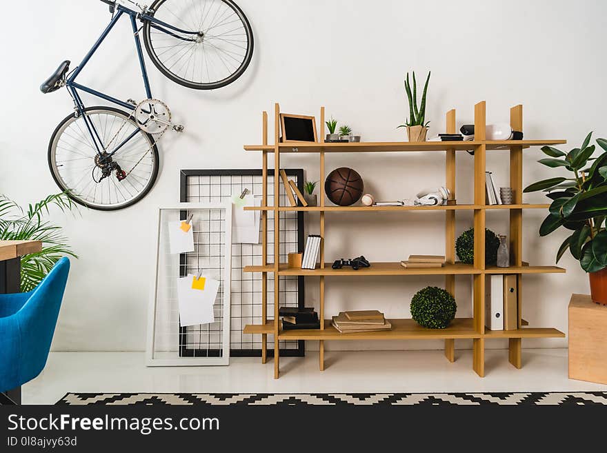 bike on wall and shelves with stuff