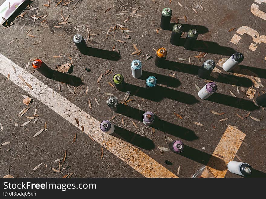 top view of cans with colorful spray paint for graffiti