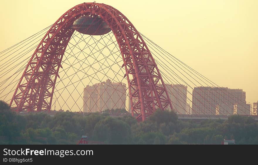 Moscow cityscape in the evening involving cable-stayed Zhivopisny Bridge and luxury apartment buildings, Russia