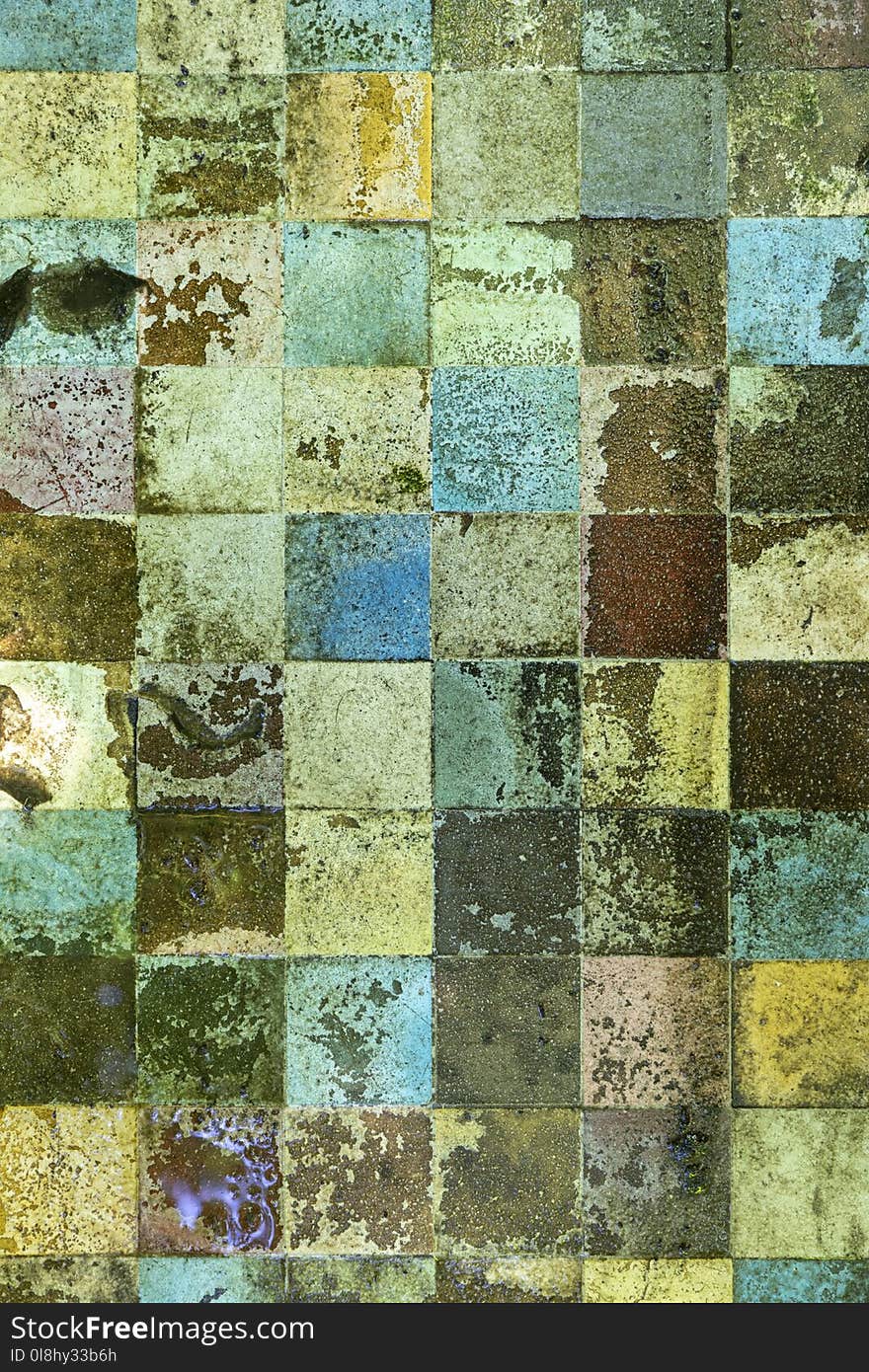 Old dirty enamel mosaic in the garden