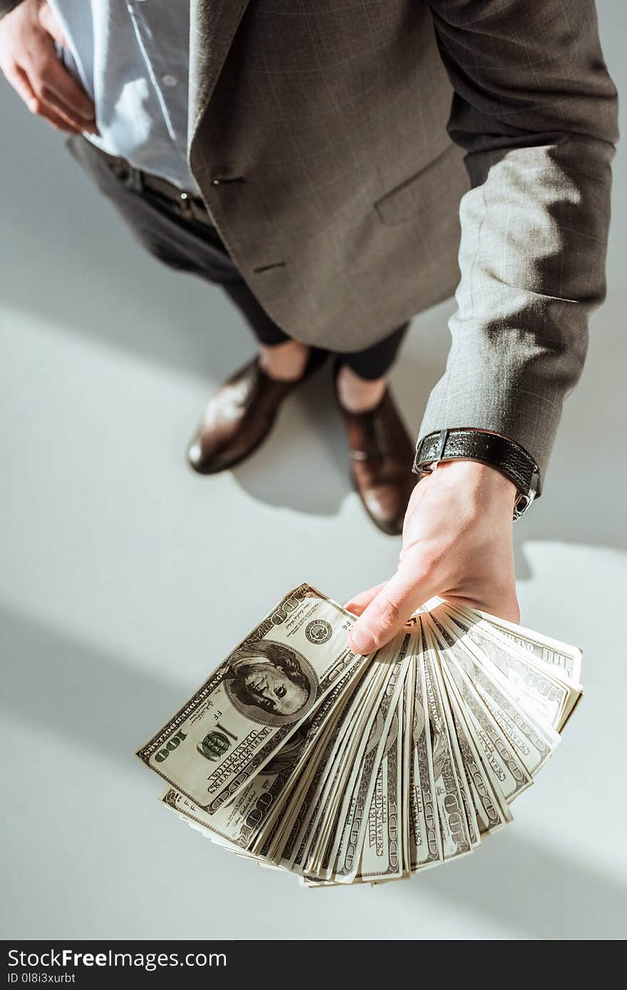 Close-up view of businessman holding money in hand