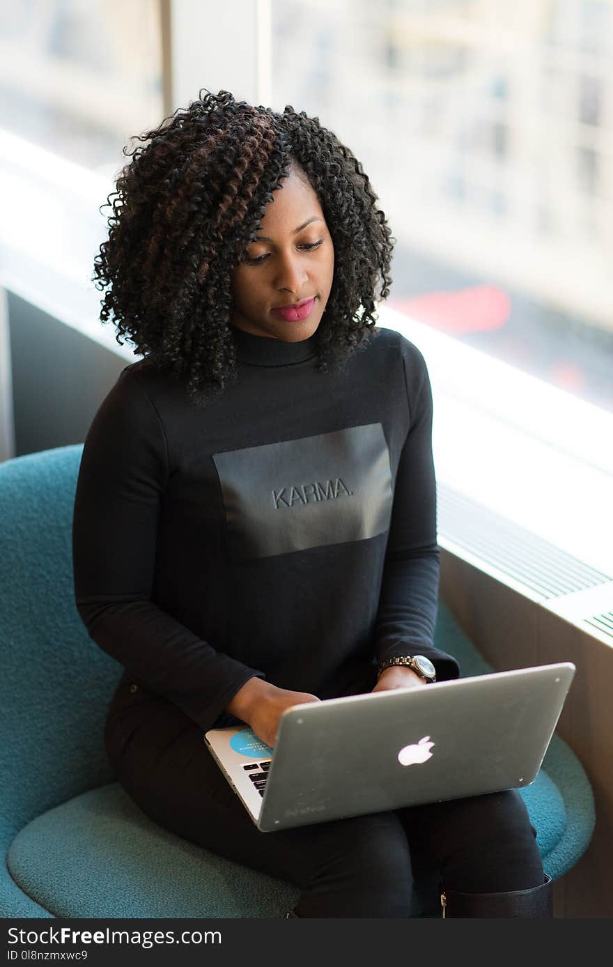 Woman in Black Long-sleeved Shirt Using Laptop