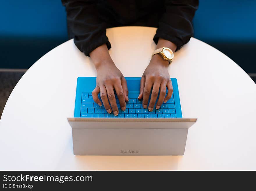 Person Typing on a Laptop