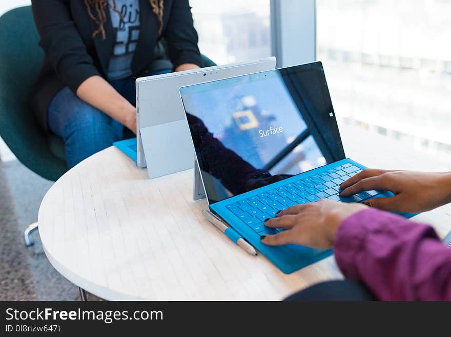 Person Using Microsoft Windows 3 on Table