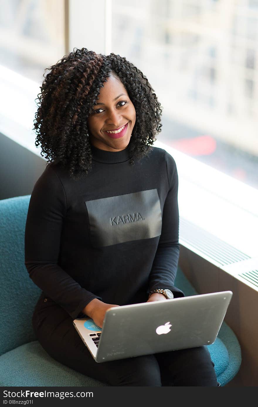 Woman Wearing Black Sweatshirt Using Silver Macbook