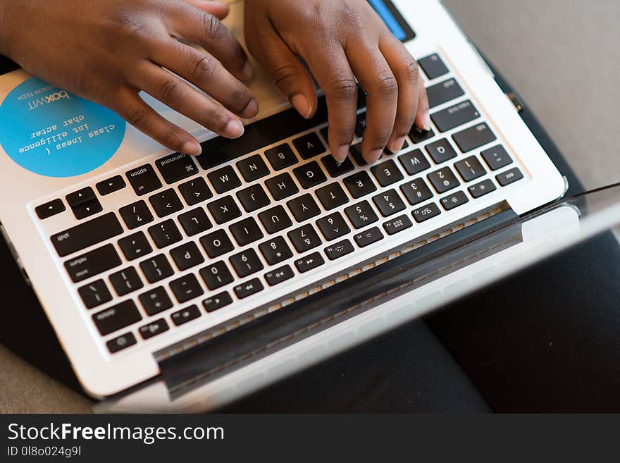 Person Using Silver Laptop Computer