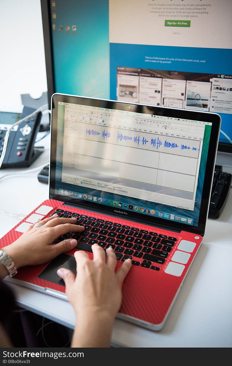 Person&#x27;s Hands on Turned on Macbook Pro