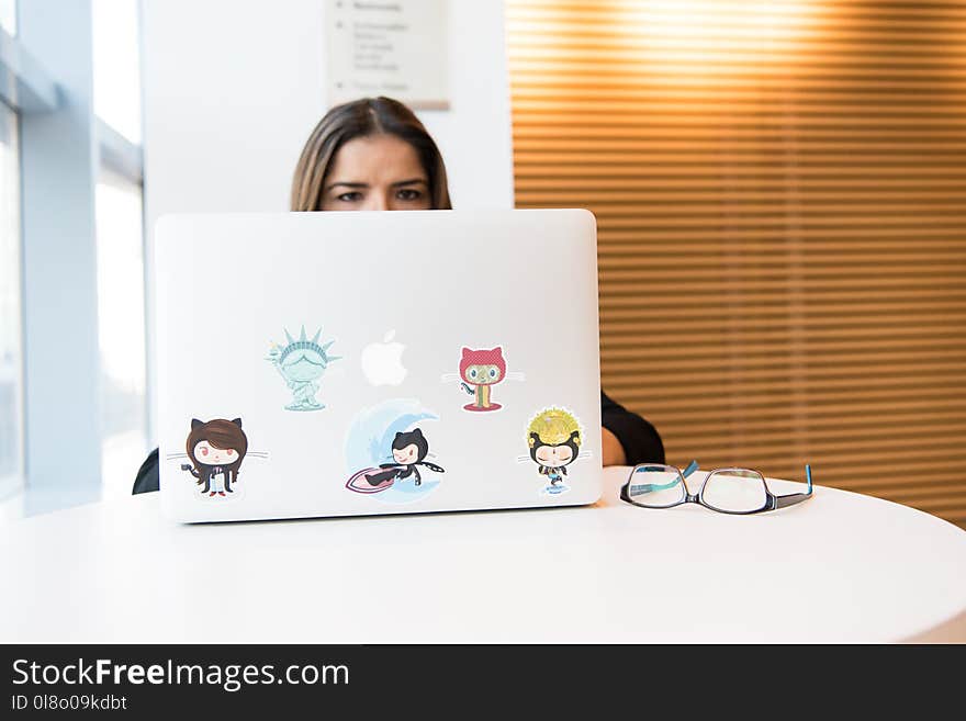 Woman Sitting in Front of Laptop