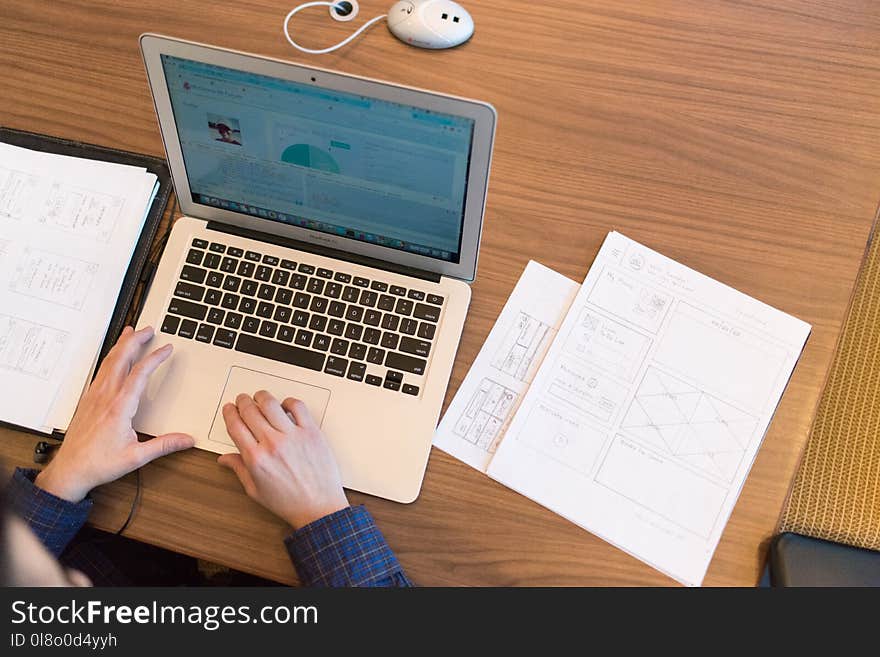 Person&#x27;s Hands on Top of Macbook Air