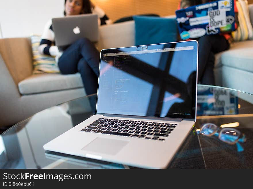 Closeup Photo of Silver Macbook Pro on Table