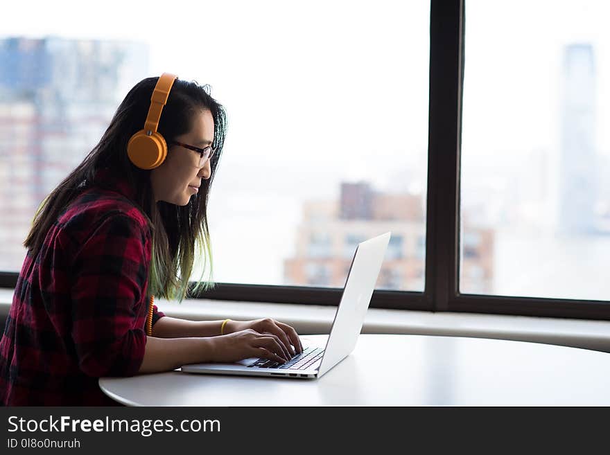 Photography of Woman Using Laptop