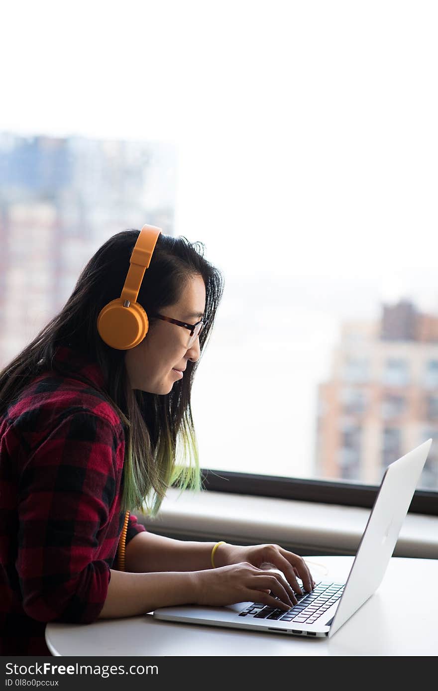 Photography of Woman Using Laptop