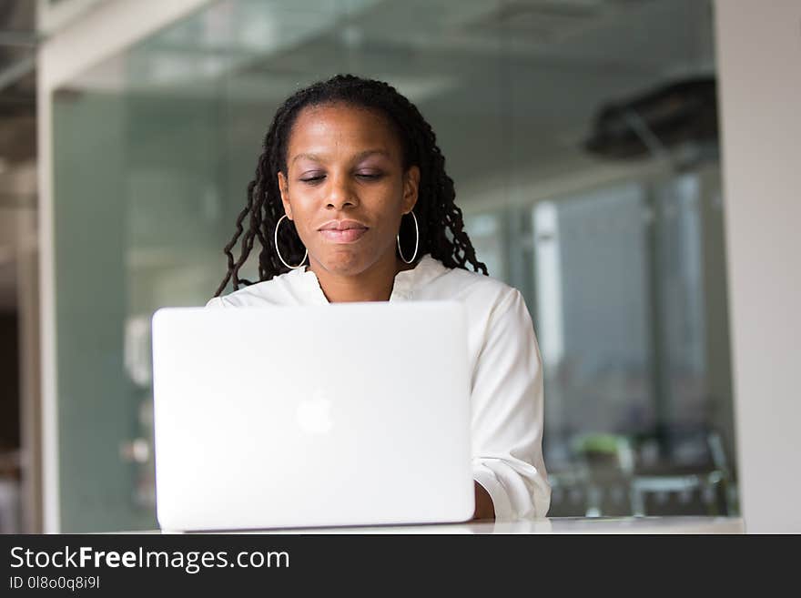 Photography of Woman Using Laptop