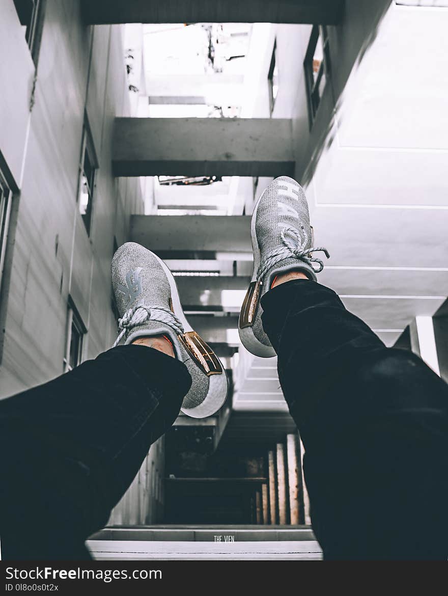 Pair of Gray-and-white Athletic Shoes