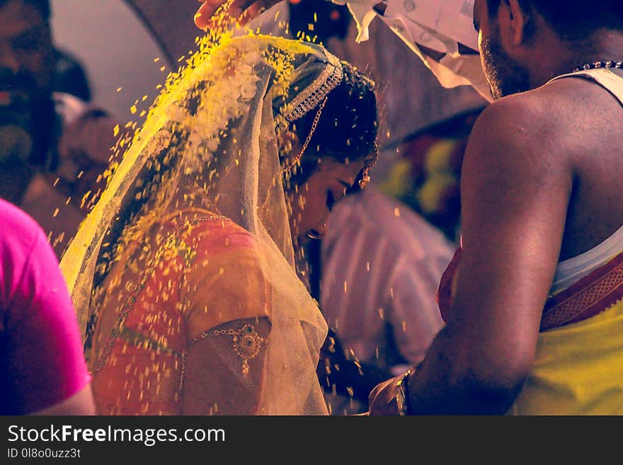 Man Pouring Woman Yellow Flowers