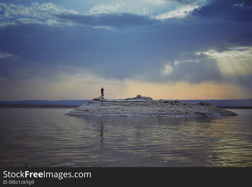 Person on Island during Sunset