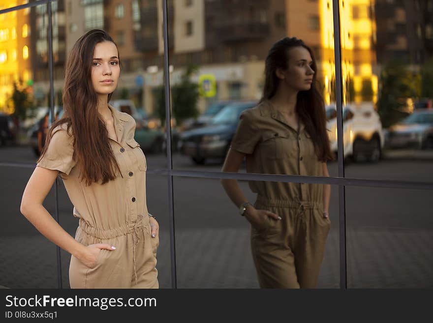 Fashion city portrait of stylish woman, natural nude makeup, long brunette hairs, walking alone at weekend, enjoy vacation, trendy summer outfit, evening soft sunlight