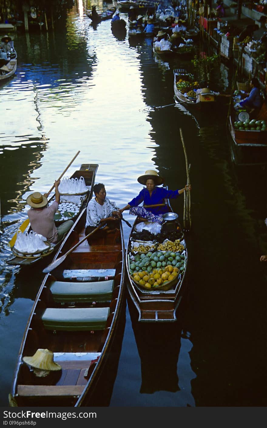 Person Sailing Boat on the Market