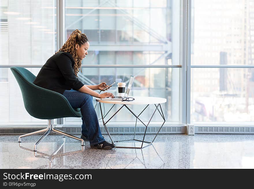 Woman Sitting on Blue and Gray Chair