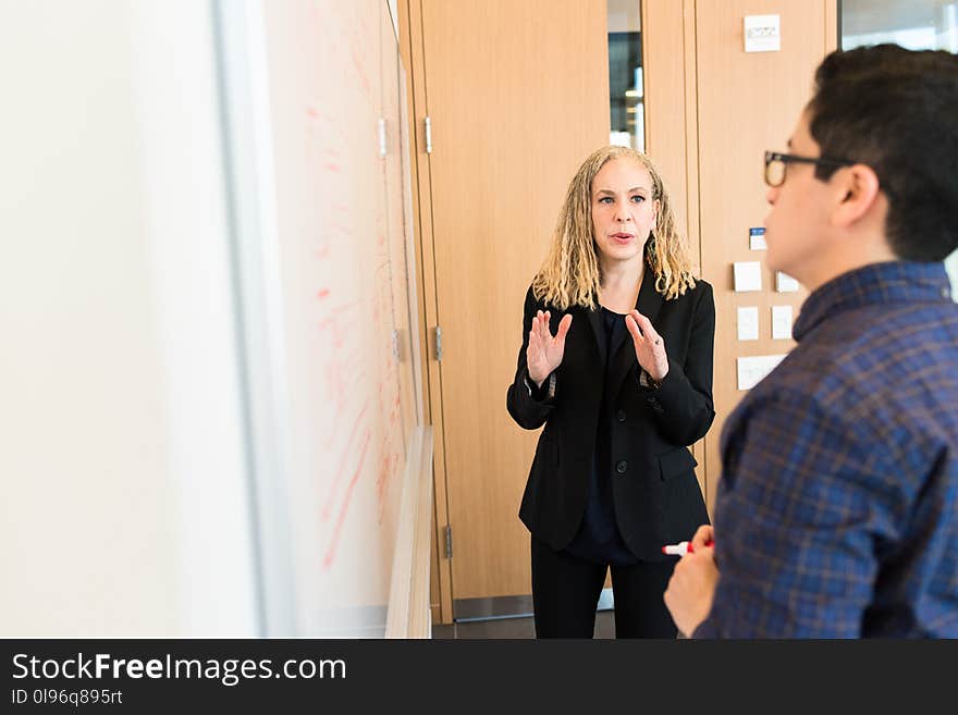 Woman Standing Near Whiteboard