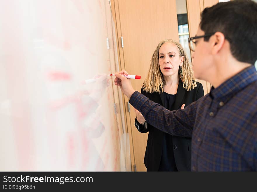 Man Writing On Board