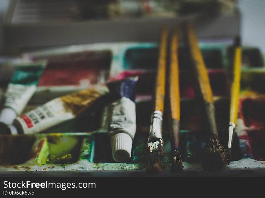 Yellow and Gray Paint Brushes With Paint Tray