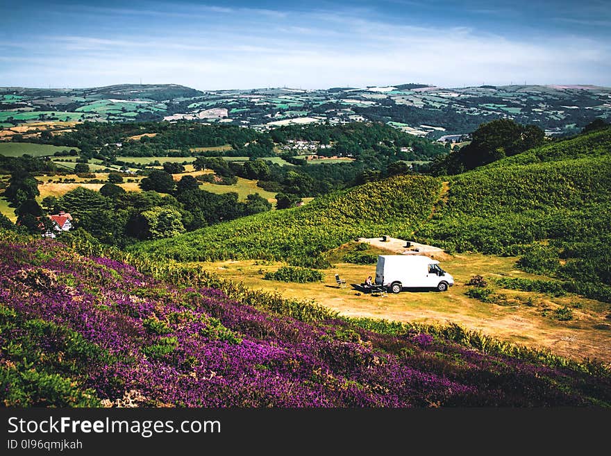 White Ford Transit Van on Greenfield