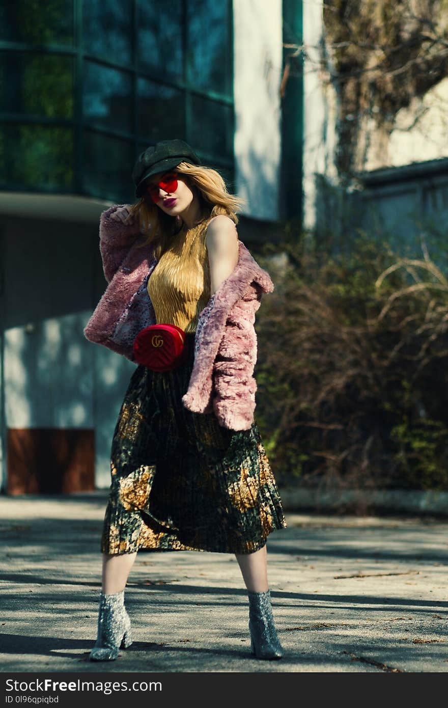 Woman Standing Wearing Pink Coat