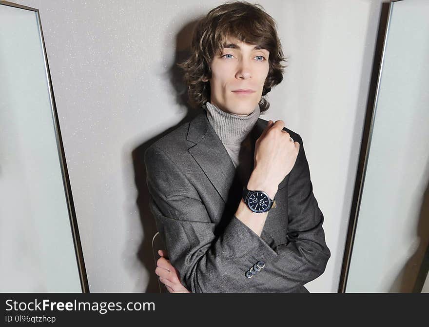 Portrait of Man Wearing Gray Suit Jacket Posing.