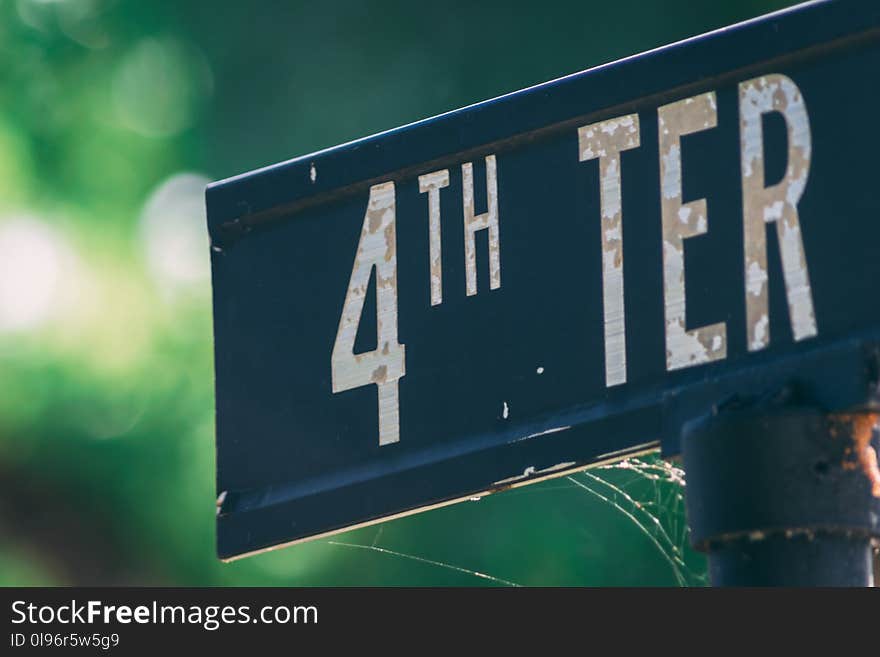 Blue and White Metal 4th Ter Signage