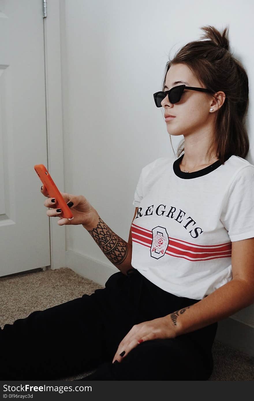 Woman Wearing Black Sunglasses Holding Android Smartphone