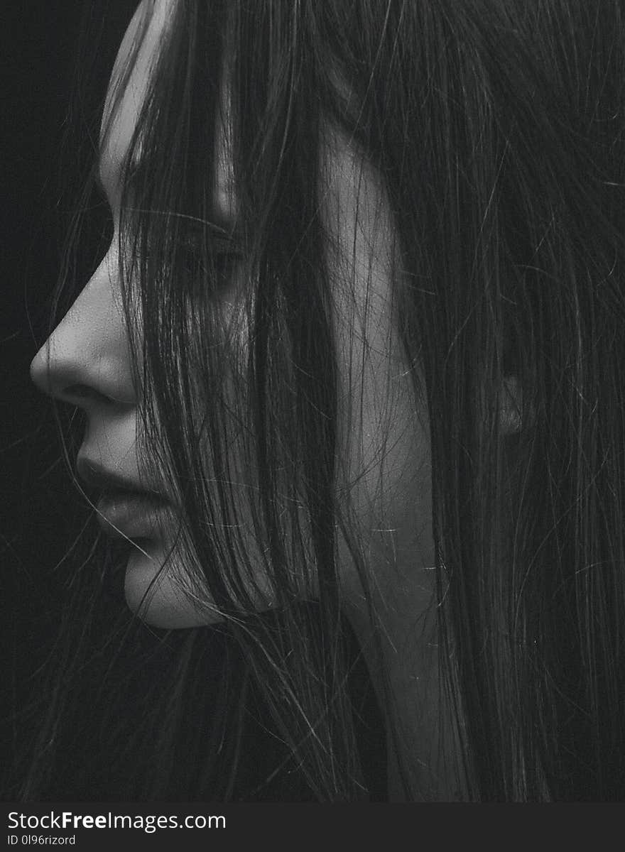 Grayscale Photo of hair partially covering girl&#x27;s face