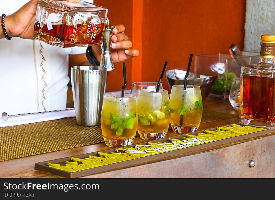 Person Preparing Rum Drink