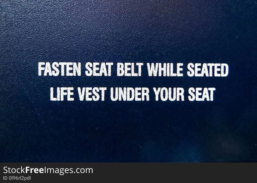 Fasten Seat Belt While Seated Life Vest Under Your Seat Text Overlay