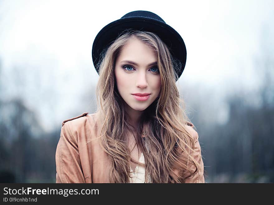 Beautiful young woman outdoors in park.