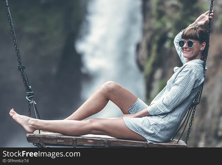 Woman Sitting On Swing