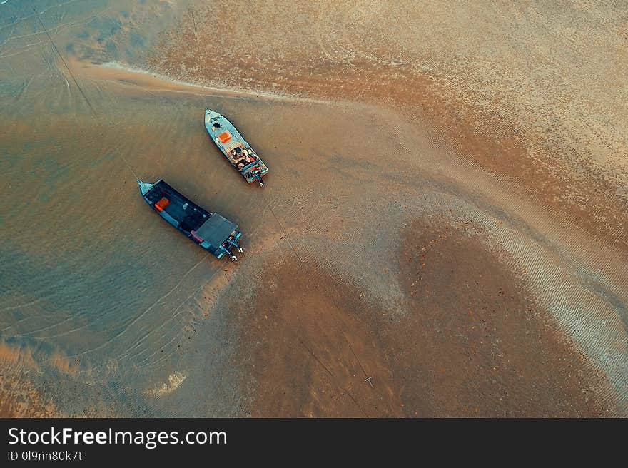 Bird&#x27;s-eye View of Two Boats on Water Near Shore