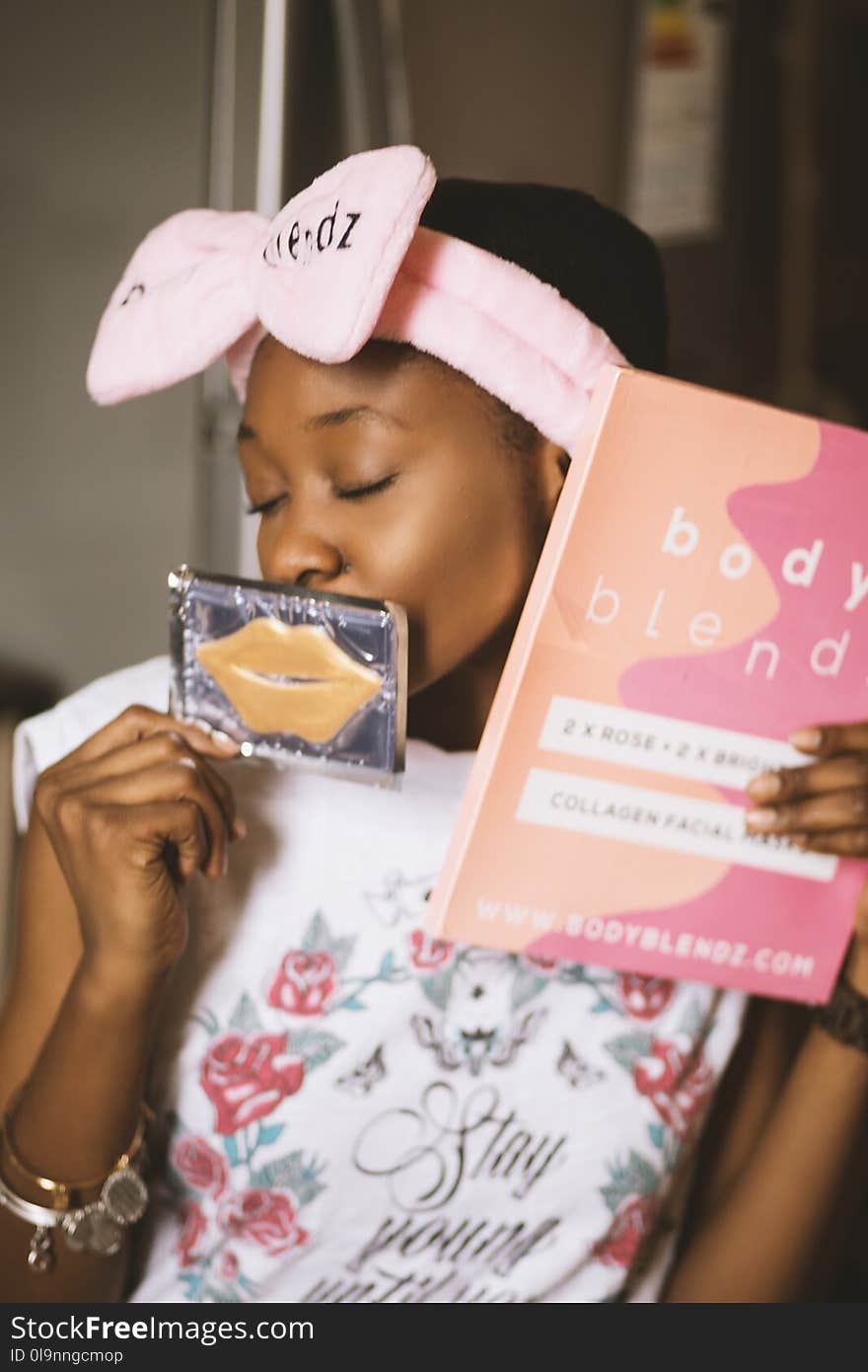 Woman Holding Two Cosmetic Product Boxes