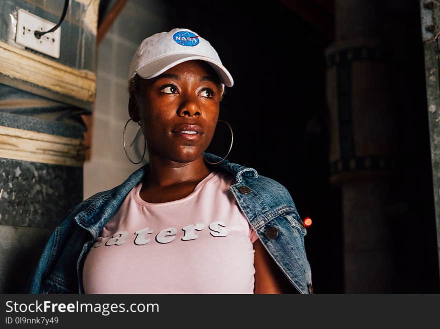 Woman Wearing White Cap and Pink Crew-neck Shirt