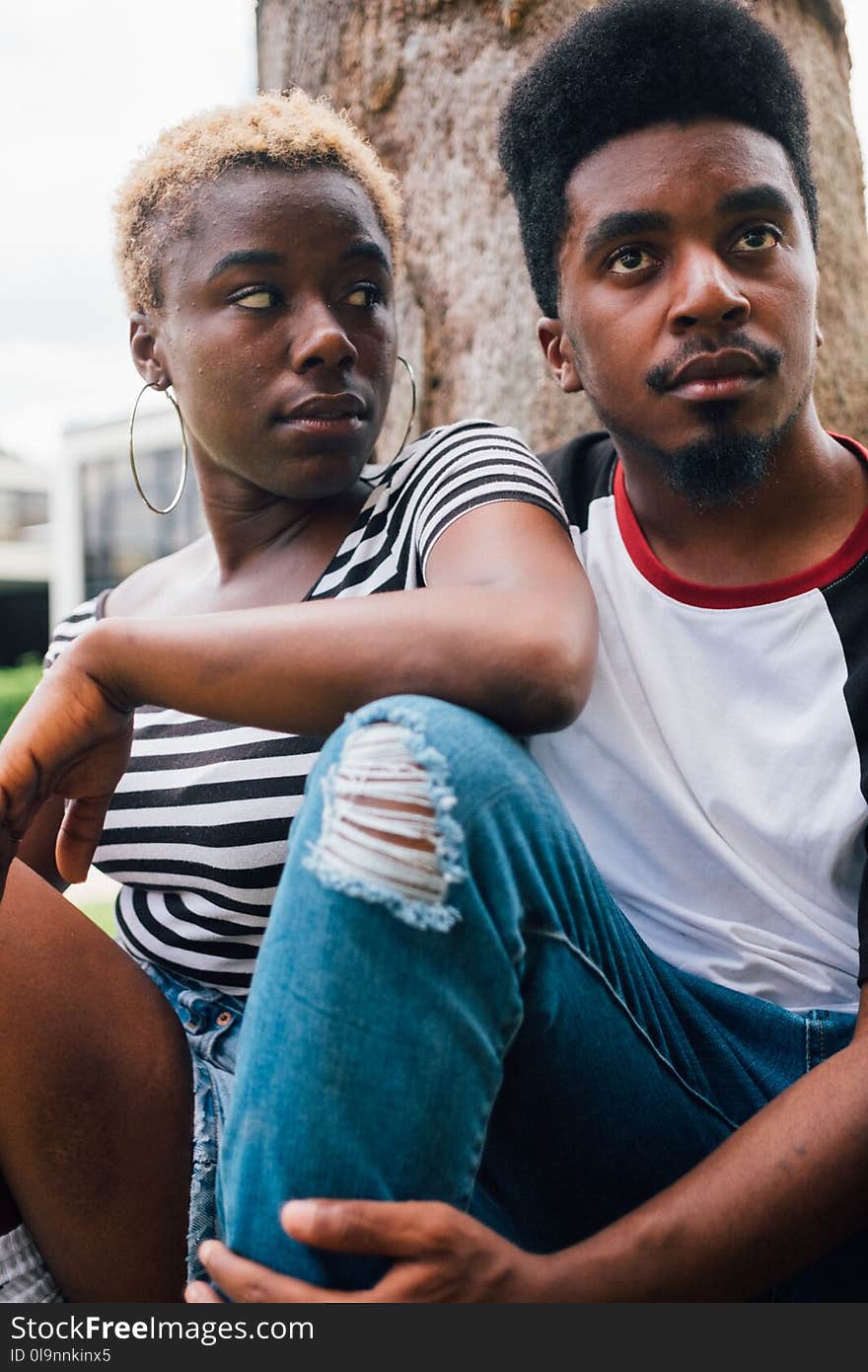 Man Sitting Beside Woman