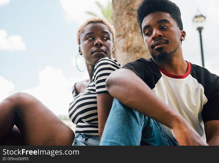 Man Sitting Beside Woman