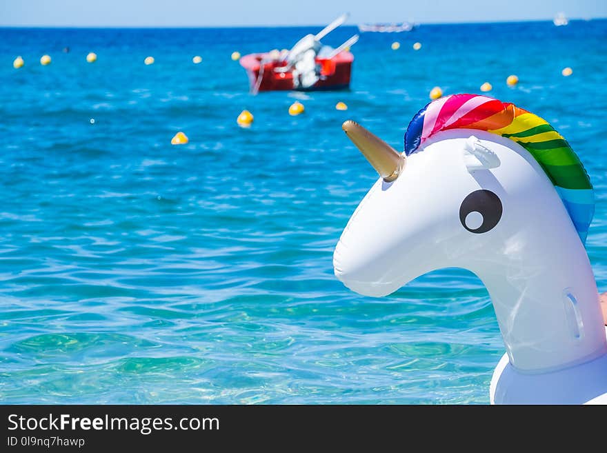 Unicorn swim tube on the beachInflatable unicorn.Fantasy Swim Ring for Summer Pool Trip. Unicorn swim tube on the beachInflatable unicorn.Fantasy Swim Ring for Summer Pool Trip