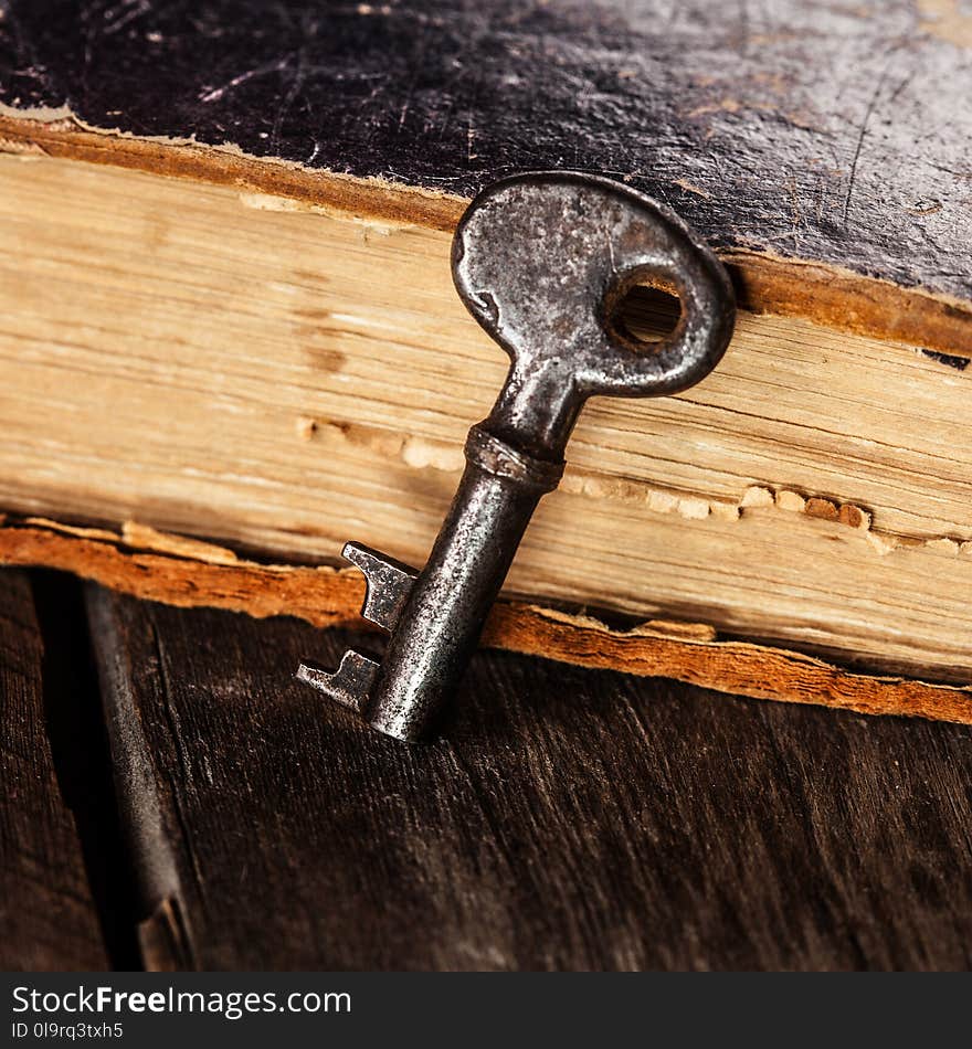 old keys on a vintage book close up image