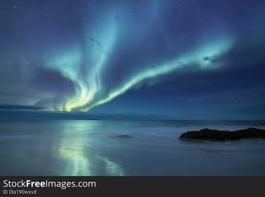 Northen Light Above Ocean In The Norway