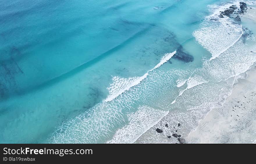 Wave on the beach as a background. Beautiful natural background at the summer time