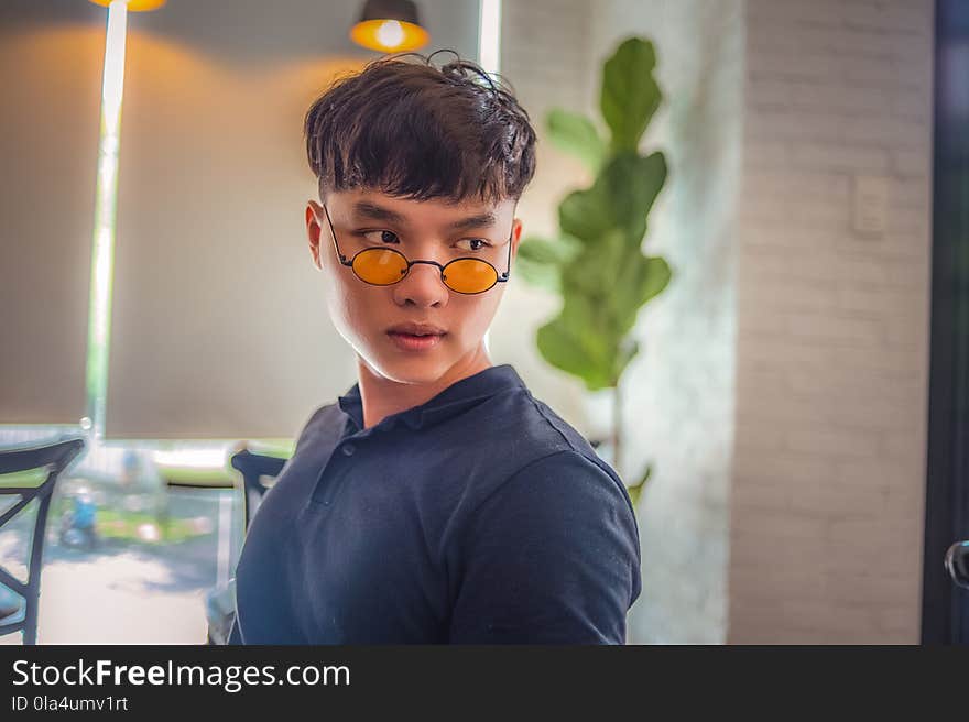 Portrait Photography of Person Wearing Hippy Eyeglasses