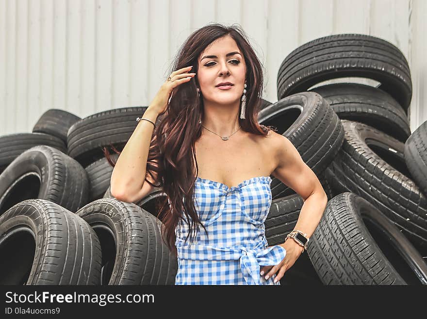 Woman Standing in Front of Car Tires